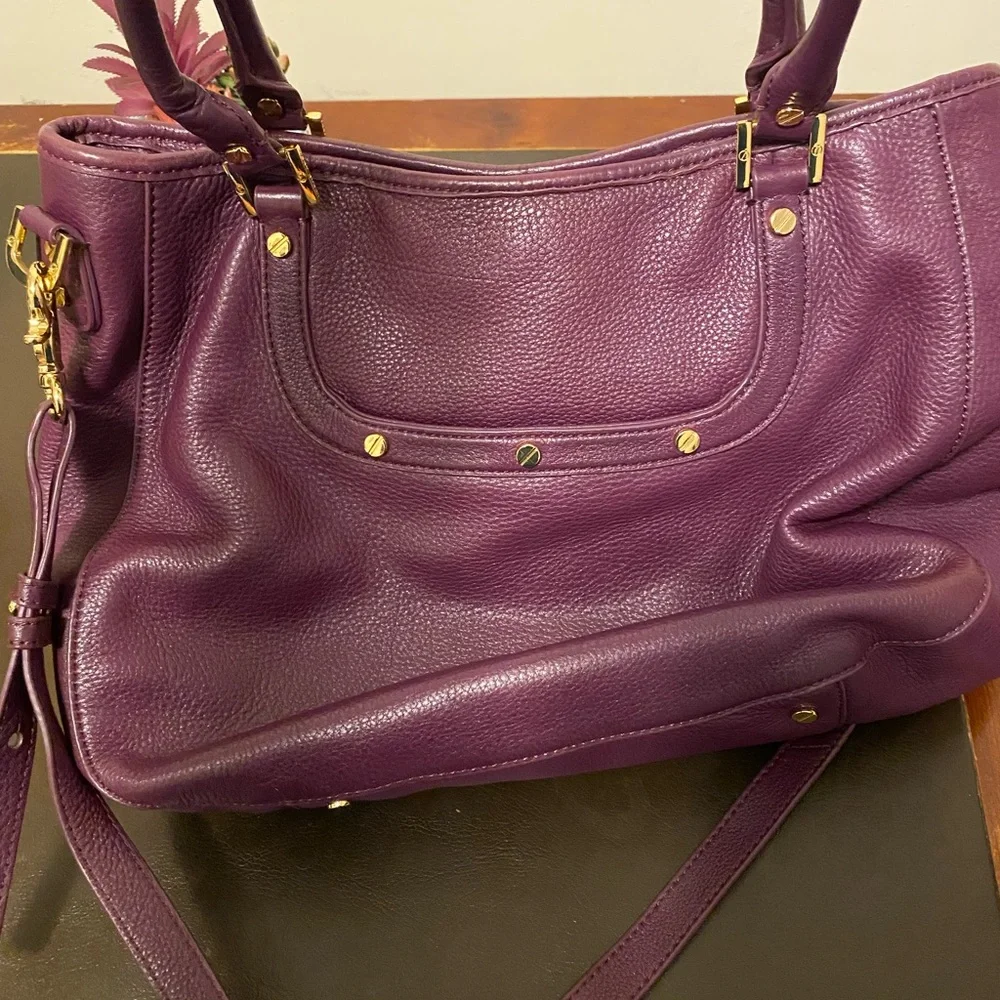 Tory Burch purple bag.